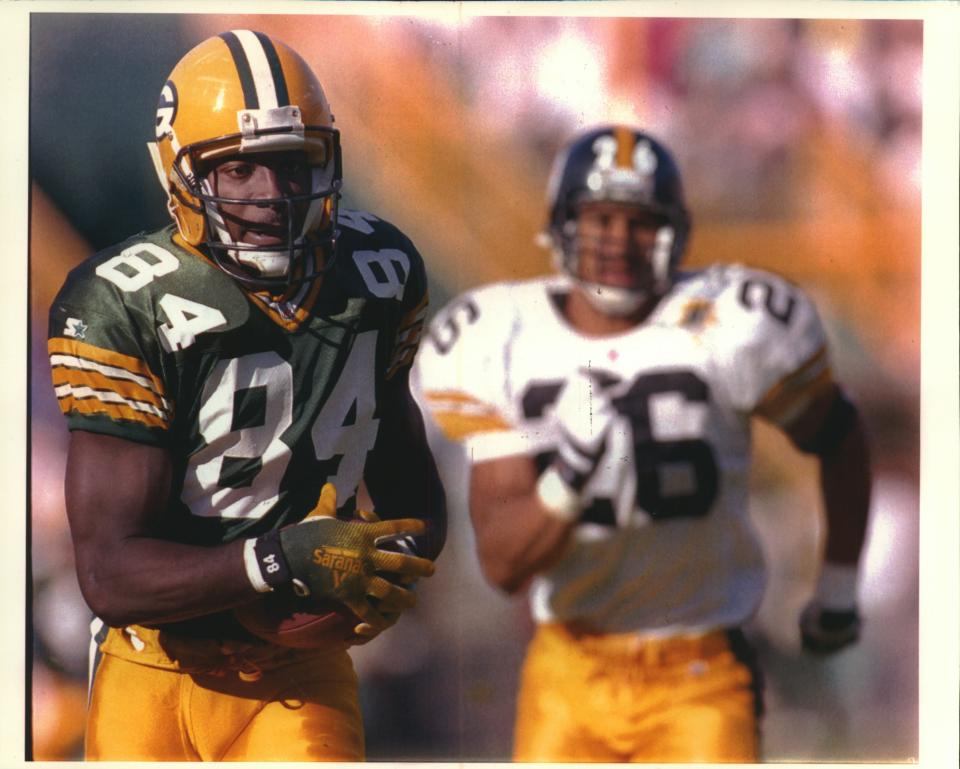 Green Bay Packers receiver Sterling Sharpe scores a touchdown against Pittsburgh.