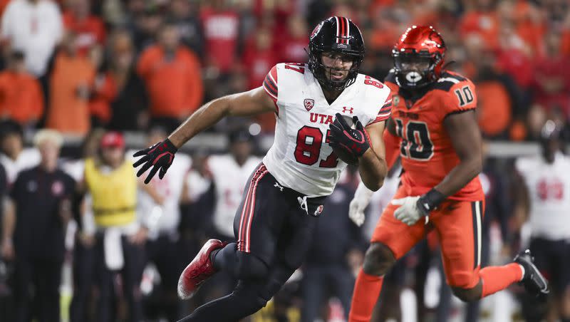 Utah tight end Thomas Yassmin (87) runs past Oregon State linebacker Andrew Chatfield Jr. (10) during an NCAA college football game on Friday, Sept. 29, 2023, in Corvallis, Ore. Oregon State won 21-7.