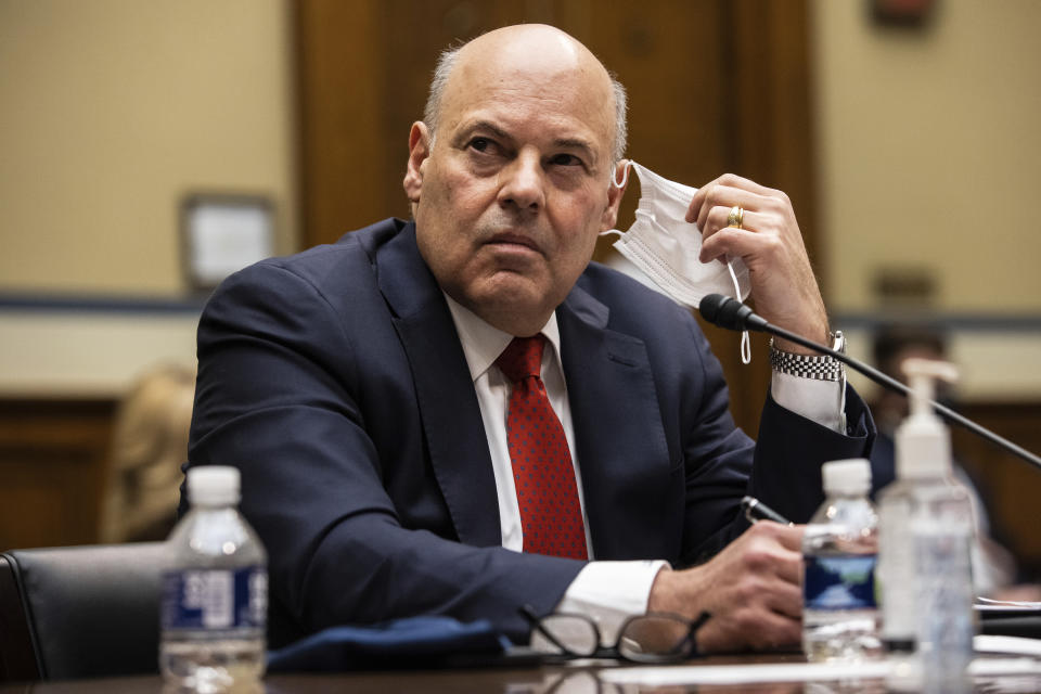 United States Postal Service Postmaster General Louis DeJoy looks on during a House Oversight and Reform Committee hearing on "Legislative Proposals to Put the Postal Service on Sustainable Financial Footing" on Capitol Hill, Wednesday, Feb. 24, 2021, in Washington. (Graeme Jennings/Pool via AP)