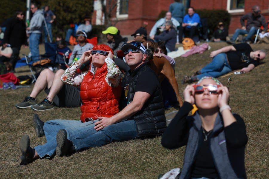 HOULTON, MAINE – APRIL 08: People watch the eclipse on April 08, 2024 in Houlton, Maine. Millions of people have flocked to areas across North America that are in the “path of totality” in order to experience a total solar eclipse. During the event, the moon will pass in between the sun and the Earth, appearing to block the sun. (Photo by Joe Raedle/Getty Images) (Photo by Joe Raedle/Getty Images)