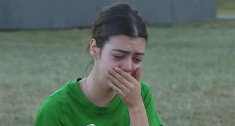 A devastated dog owner cries at a Brisbane park days after two dog had to be put down, believed to have been baited. Source: 9 News