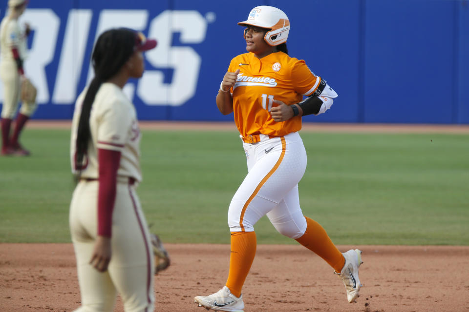 Tennessee's Zaida Puni runs the bases after hitting a home run against Florida State during the first inning of an NCAA softball Women's College World Series game, Monday, June 5, 2023, in Oklahoma City. (AP Photo/Nate Billings)