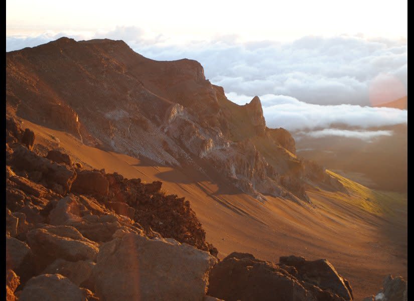 Riding a bike in Maui might not seem extraordinary — until you consider the route is an adrenalin-pumping, 6,000-foot plunge down the outside of Haleakala volcano. (And you don’t have to be in Tour de France shape to make the ride.) Of the nine companies that offer volcano bike trips, <a href="http://www.destinationweddingmag.com/gallery/bucket-list-honeymoon-destinations-maui-hawaii?src=SYN&dom=huffpo" target="_hplink">Haleakala Bike Co.</a> offers the freedom to ride the route at your own pace rather than with a tightly packed guided group. Even with the 1:30 AM call-time, all it takes is one amazing Haleakala sunrise from the 10,000-foot summit to see why the ancient Hawaiians called this mountain “House of the Sun.” Stay at luxe <a href="http://www.destinationweddingmag.com/gallery/bucket-list-honeymoon-destinations-maui-hawaii?src=SYN&dom=huffpo" target="_hplink">Ritz-Carlton, Kapalua</a>, and post-ride you can soothe your muscles with a massage at the spa. <em>Photo by Joe Yogerst</em>  <strong>Related: <a href="http://www.destinationweddingmag.com/gallery/10-romantic-beach-honeymoon-destinations?src=SYN&dom=huffpo" target="_hplink">Best Beach Honeymoon Destinations</a></strong>