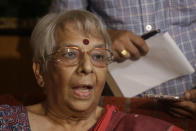 Nirmala Banerjee, mother of Abhijit Banerjee, interacts with media after Nobel Prize in economics was announced at her home in Kolkata, India, Monday, Oct. 14, 2019. The 2019 Nobel Prize in economics was awarded Monday to Abhijit Banerjee, Esther Duflo and Michael Kremer for pioneering new ways to alleviate global poverty. (AP Photo/Bikas Das)