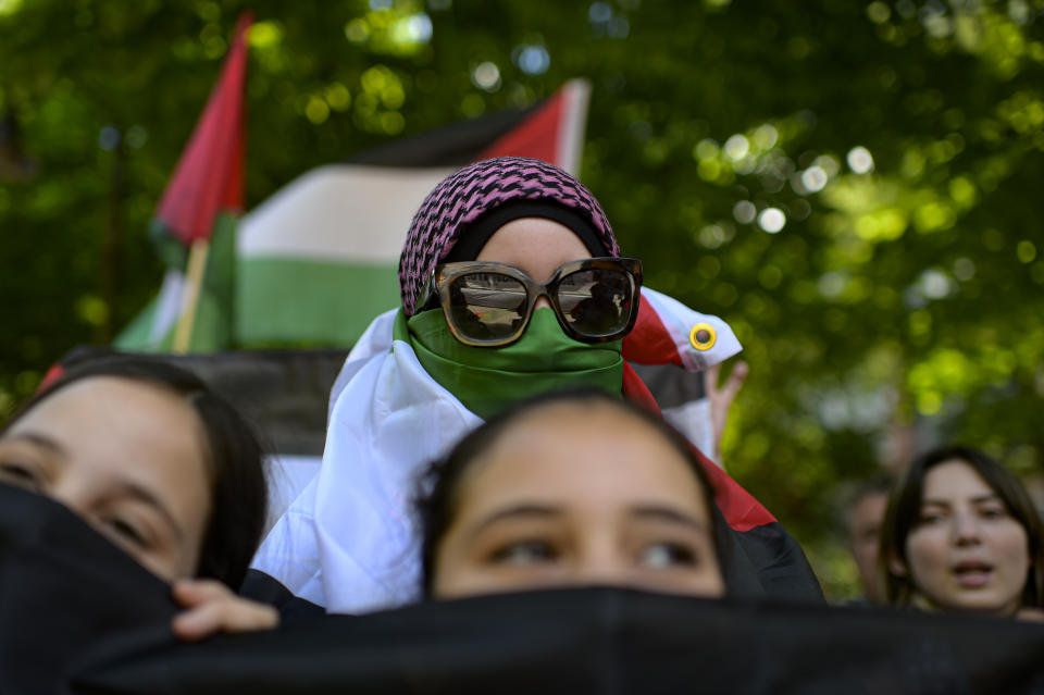 Palestinian supporters in Spain attend a demonstration against Israeli attacks on Gaza.