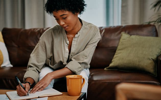 Creative activities, like journaling, can help you manage your symptoms. (Photo: Delmaine Donson via Getty Images)