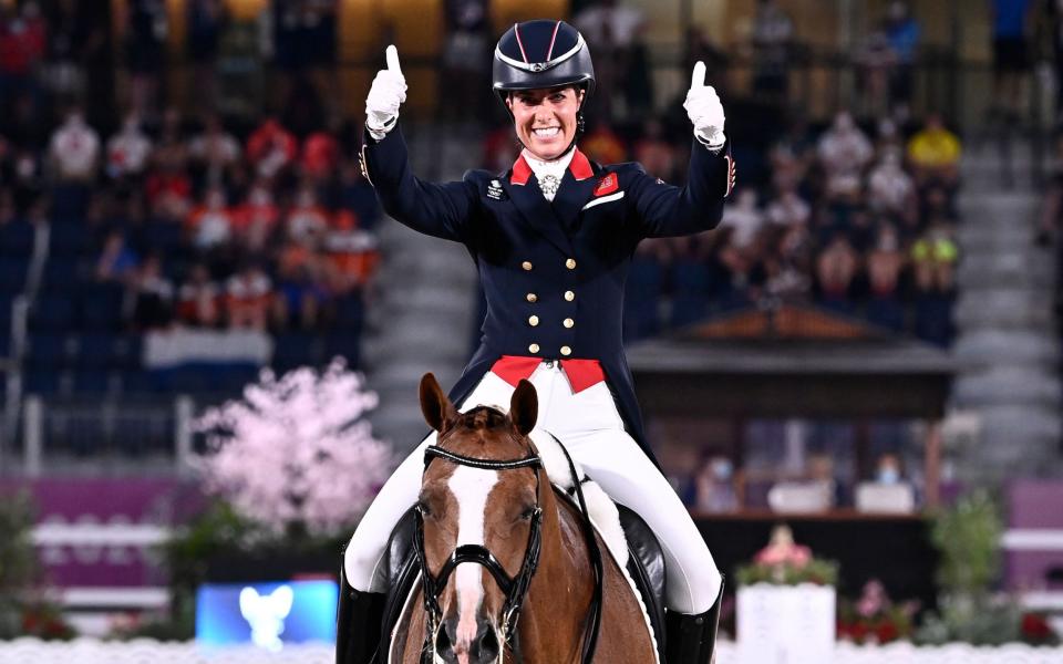 Charlotte Dujardin celebrates her bronze medal to become Britain's most decorated woman Olympian - SHUTTERSTOCK