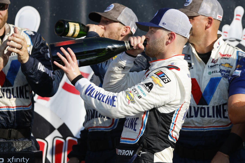 William Byron celebrates his victory with pit crew after a NASCAR Cup Series auto race in Watkins Glen, N.Y., Sunday, Aug. 20, 2023. (AP Photo/Jeffrey T. Barnes)