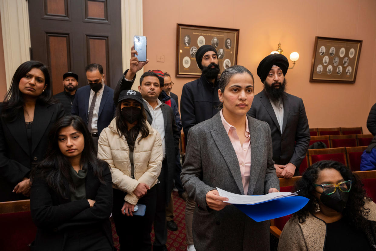 Califiornia state Sen. Aisha Wahab, foreground, listens to speakers during a news conference