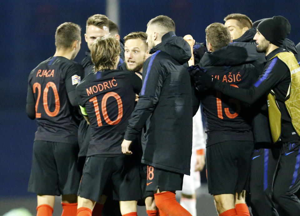 Croatia's players celebrate at the end of the UEFA Nations League soccer match between Croatia and Spain at the Maksimir stadium in Zagreb, Croatia, Thursday, Nov. 15, 2018. (AP Photo/Darko Bandic)