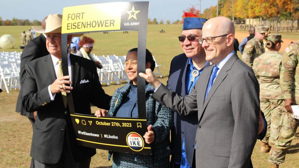 Four members of the Naming Commission — from left to right: businessman and former Army drill sergeant Jerry Buchanan, retired Navy Adm. Michelle Howard, retired Air Force Lt. Col. Lawrence Romo and retired Army Brig. Gen. Ty Seidule — pose after the redesignation ceremony for Fort Eisenhower, Georgia, on October 27, 2023. The event was the final base renaming event. (Davis Winkie/Staff)
