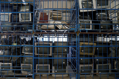 TV sets about to be recycled are seen in a warehouse at the government-sponsored recycling park in the township of Guiyu, Guangdong Province, China January 12, 2018. REUTERS/Aly Song