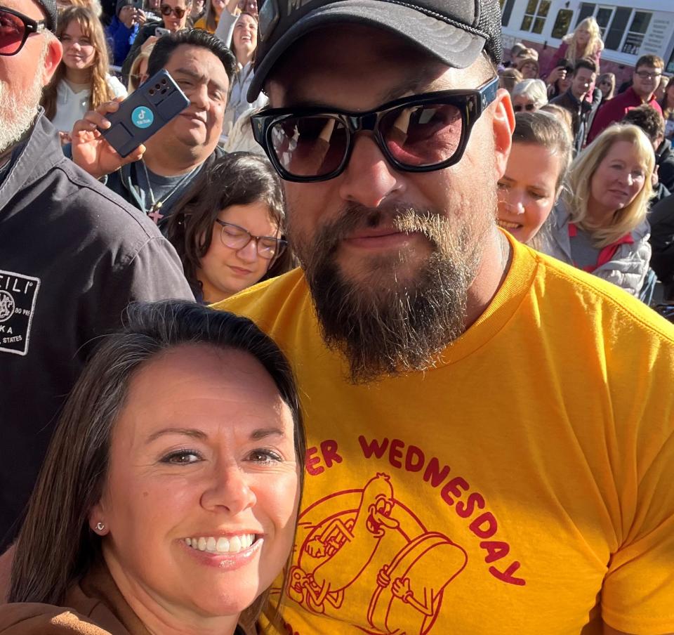 Lindsey Aaron, left, reunited with her high school boyfriend, Jason Momoa, during his fall 2023 stop at Fareway in Norwalk to promote his new vodka line.