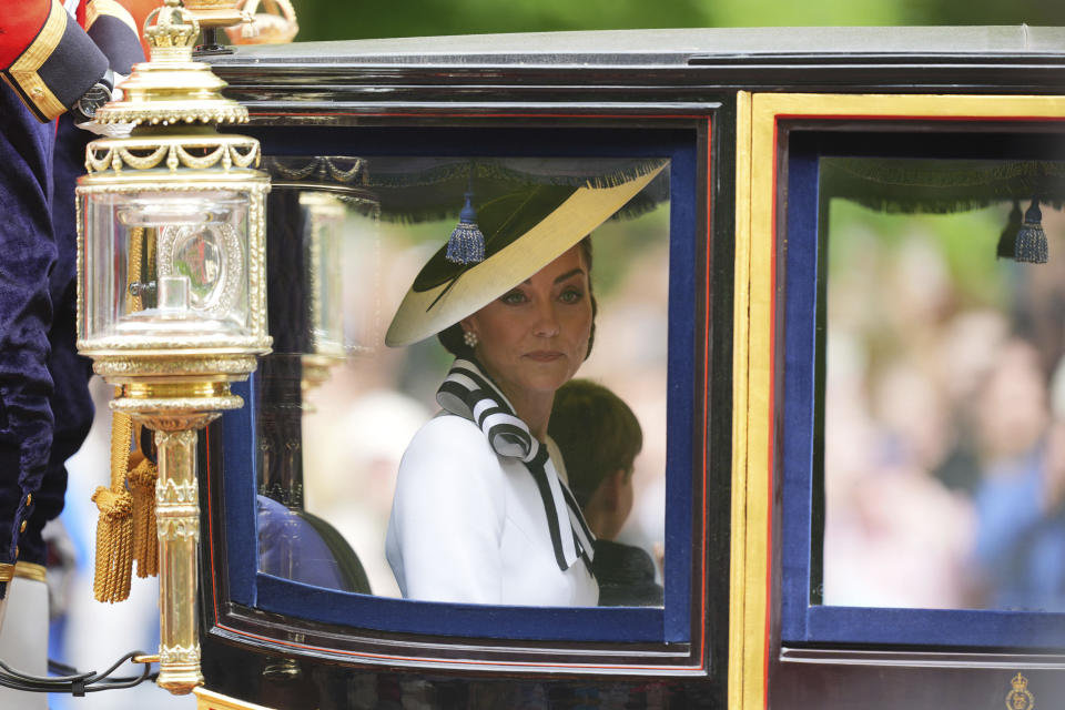 Britain's Kate, Princess of Wales travels along The Mall to the Trooping the Colour ceremony at Horse Guards Parade, London, Saturday, June 15, 2024. Britain is putting on a display of birthday pageantry for King Charles III, a military parade that is the Princess of Wales’ first public appearance since her cancer diagnosis early this year. (James Manning/PA via AP)