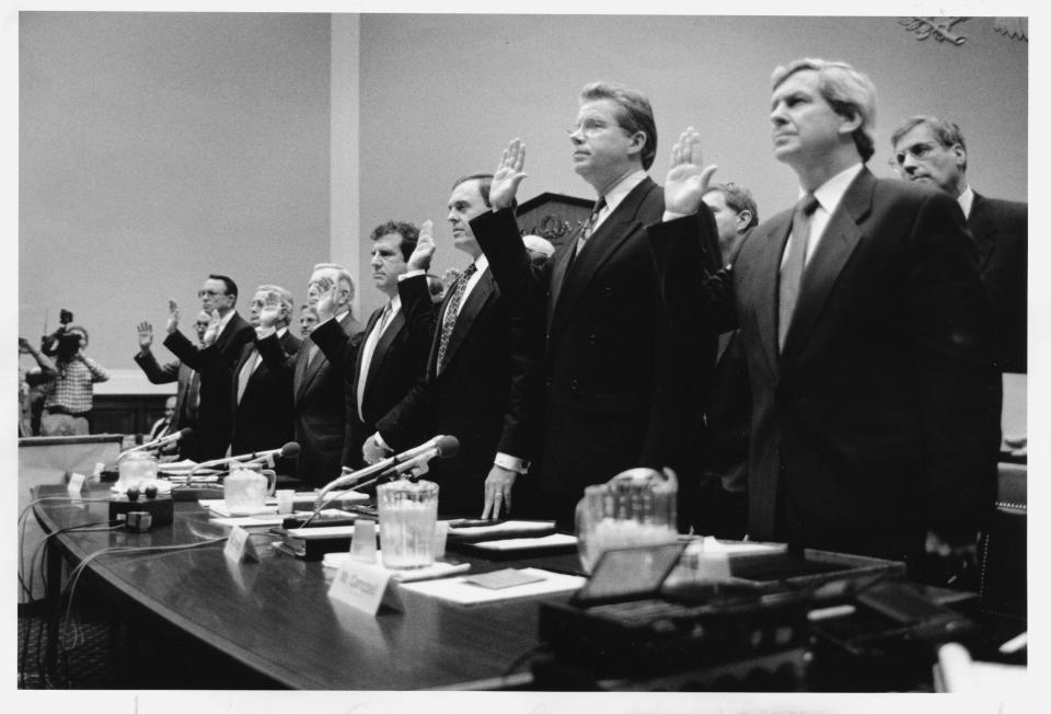 WASHINGTON, DC - APRIL 14:  Tobacco executives from left, Robert Sprinkle III, of Research American Tobacco; Donald S. Johnston, American Tobacco; Thomas E. Sandefur Jr.; Brown & Williamson Tobacco; Edward A. Horrigan Jr., Liggett Group; Andrew N. Tisch, Lorillard Tobacco; and Lorillard Tobacco; Joseph Taddeo, U.S. Tobacco; James W. Johnston, RJR Tobacco; and William I. Campbell, Phillip Morris USA, are sworn in to testify before Capitol Hill hearing. (Photo by Ray Lustig/The Washington Post via Getty Images) 