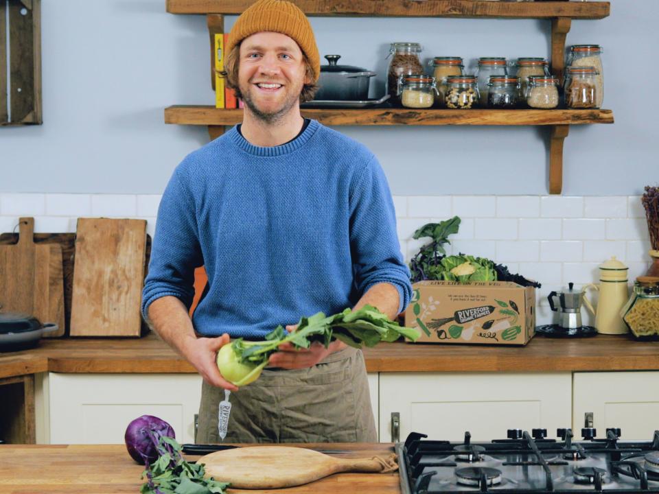 Riverford chef James Evans prepares kohlrabiRiverford