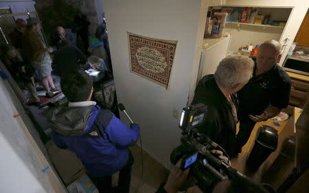 Members of the news media are shown inside the home of suspects Syed Rizwan Farook and Tashfeen Malik in Redlands, California December 4, 2015, following Wednesday's attacks. REUTERS/Mario Anzuoni