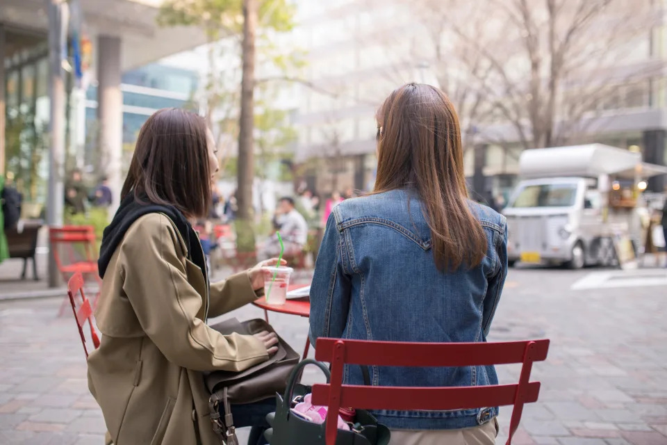 Female friends having tea time under the sun