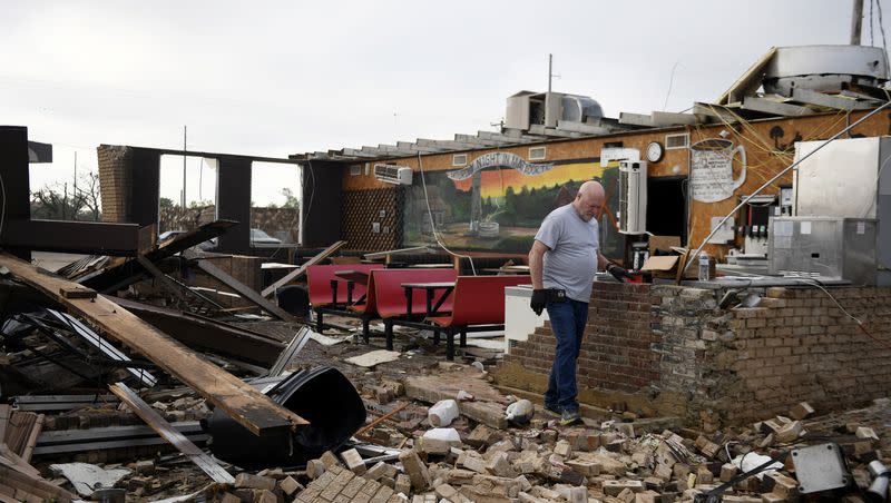 Pat Smith looks through his restaurant, Matador Diner, after a tornado, Thursday, June 22, 2023, in Matador, Texas. Smith was in the cafe during the tornado and “It felt like forever but only lasted 20 seconds.” A line of severe storms produced what a meteorologist calls a rare combination of multiple tornadoes, hurricane-force winds and softball-sized hail in west Texas, killing at least four people and causing significant damage around the town of Matador, a meteorologist said Thursday.