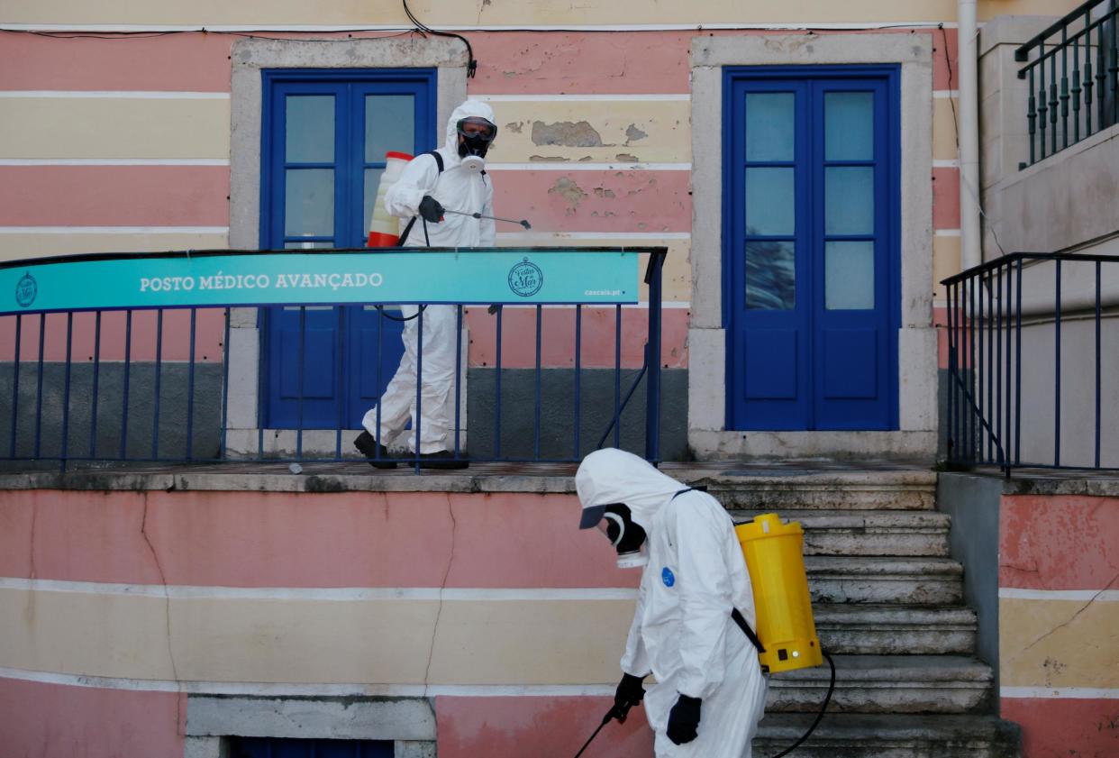 Municipal workers disinfect streets at downtown Cascais, Portugal (file photo): REUTERS