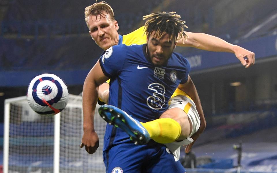 Family-sized left back Dan Burn was among the Brighton men who put in a good solid shift in defence against a dominant Chelsea side, represented here by the busy Reece James - EPA