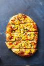 <p>With provolone, blue cheese and sliced delicata squash, this shareable pizza is a great way to kick off your Thanksgiving gathering. </p><p>Get the <strong><a href="https://www.goodhousekeeping.com/food-recipes/a41869561/delicata-squash-pizza-recipe/" rel="nofollow noopener" target="_blank" data-ylk="slk:Delicata Squash Pizza recipe;elm:context_link;itc:0;sec:content-canvas" class="link ">Delicata Squash Pizza recipe</a></strong>.</p>