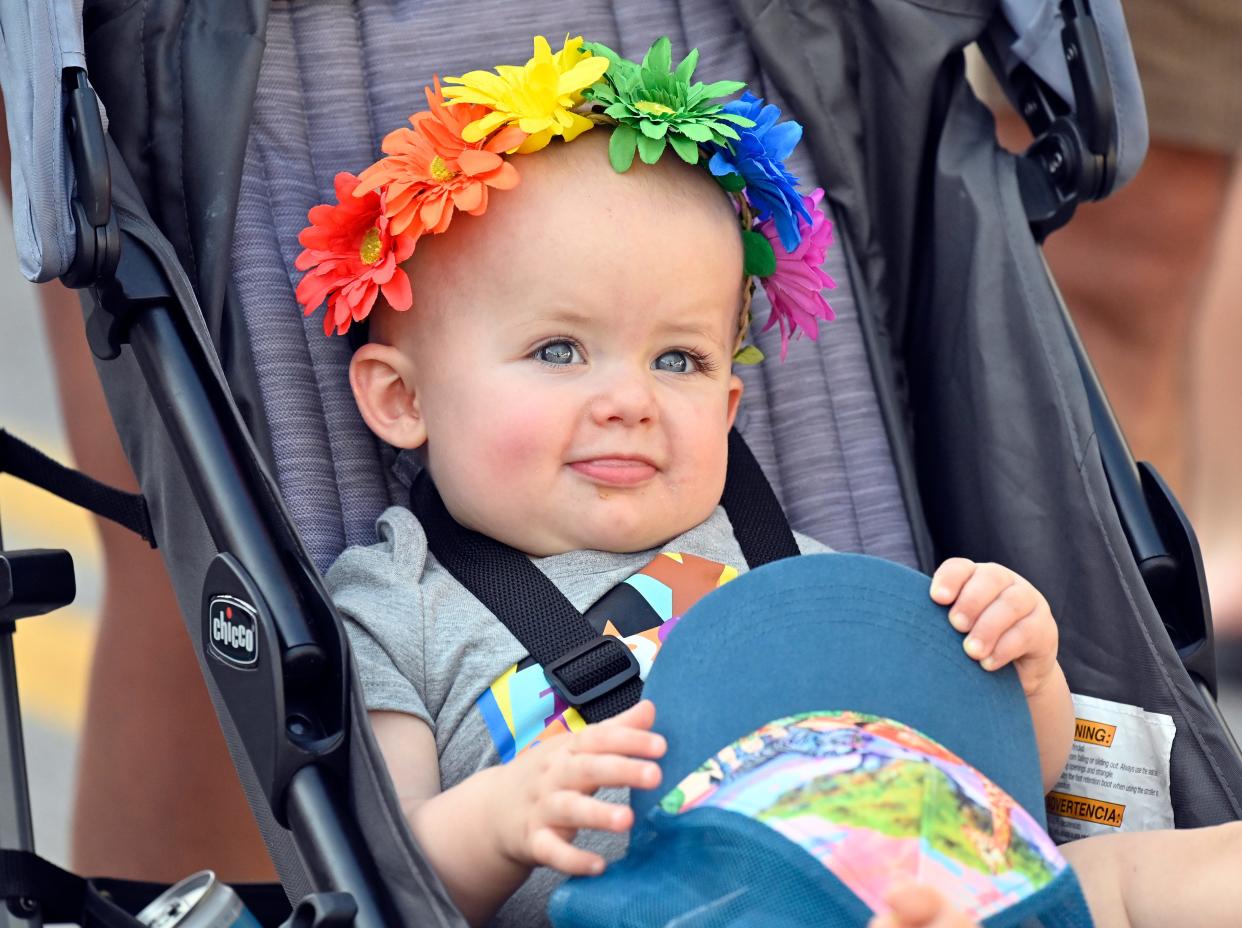 A young visitor enjoys the sights and sounds of the Louisville Pride Festival, Saturday, Sept. 17 2022 in Louisville Ky.