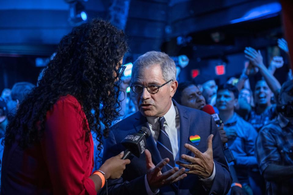 Larry Krasner speaking to reporter