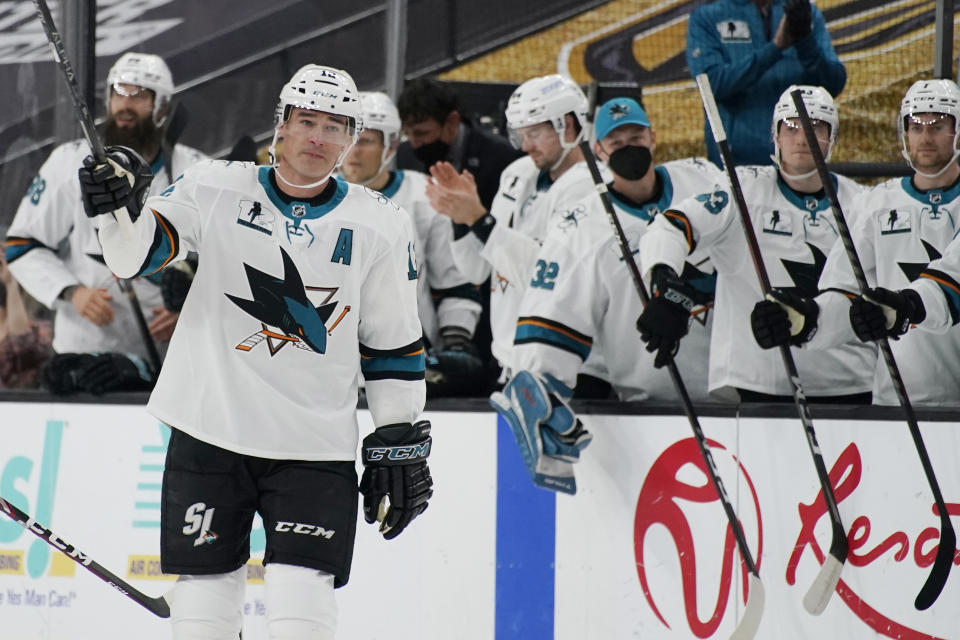 San Jose Sharks center Patrick Marleau (12) waves to the crowd during a small ceremony to mark his passing Gordie Howe for most NHL games played in the first period of an NHL hockey game Monday, April 19, 2021, in Las Vegas. (AP Photo/John Locher)
