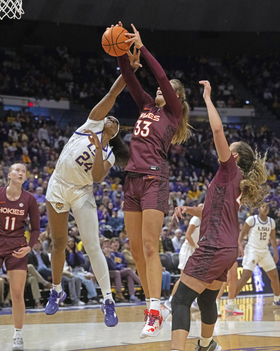 LSU guard Aneesah Morrow (24) and Virginia Tech center Elizabeth Kitley (33) vie for a rebound during an NCAA college basketball game Thursday, Nov. 30, 2023, in Baton Rouge, La. (Hilary Scheinuk/The Advocate via AP)