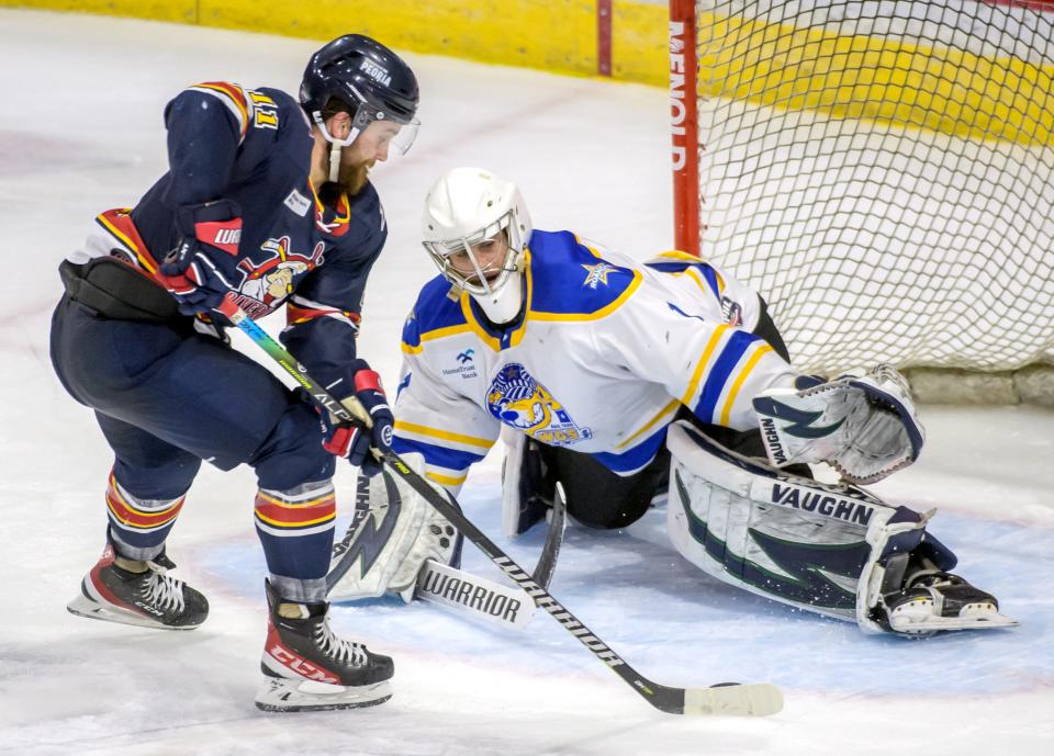 Peoria's Jordan Ernst makes a move on Roanoke goalie Austyn Roudebush late in the third period of Game Two of the SPHL finals Friday, April 29, 2022 at Carver Arena in Peoria. Ernst scored his third goal on the breakaway for a hat trick and a 7-3 lead for the Rivermen.