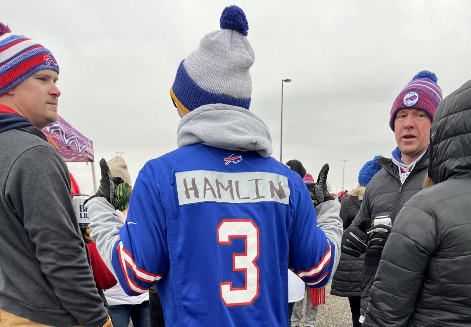 Marc Mersereau (center) and plenty of other fans in attendance at Sunday's Bills-Patriots game paid tribute to Damar Hamlin. (Jori Epstein/Yahoo Sports)