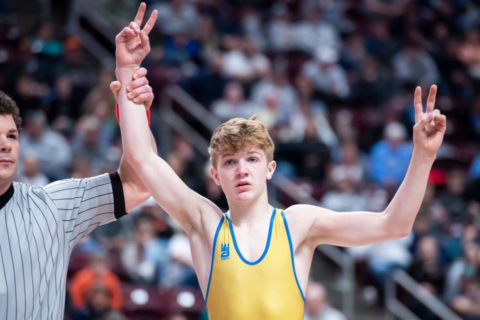 Northern Lebanon's Aaron Seidel has his hand raised after winning the 107-pound championship bout at the PIAA Class 2A Wrestling Championships at the Giant Center on March 11, 2023, in Hershey. Seidel defeated Chestnut Ridge's Dominic Deputy by decision, 6-1.