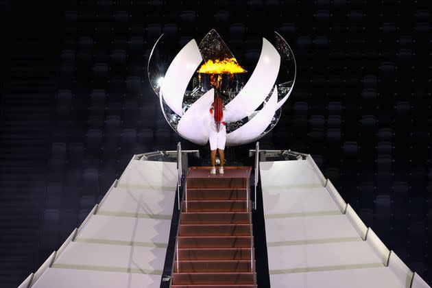 Naomi Osaka of Team Japan lights the Olympic cauldron.  (Photo: Laurence Griffiths via Getty Images)