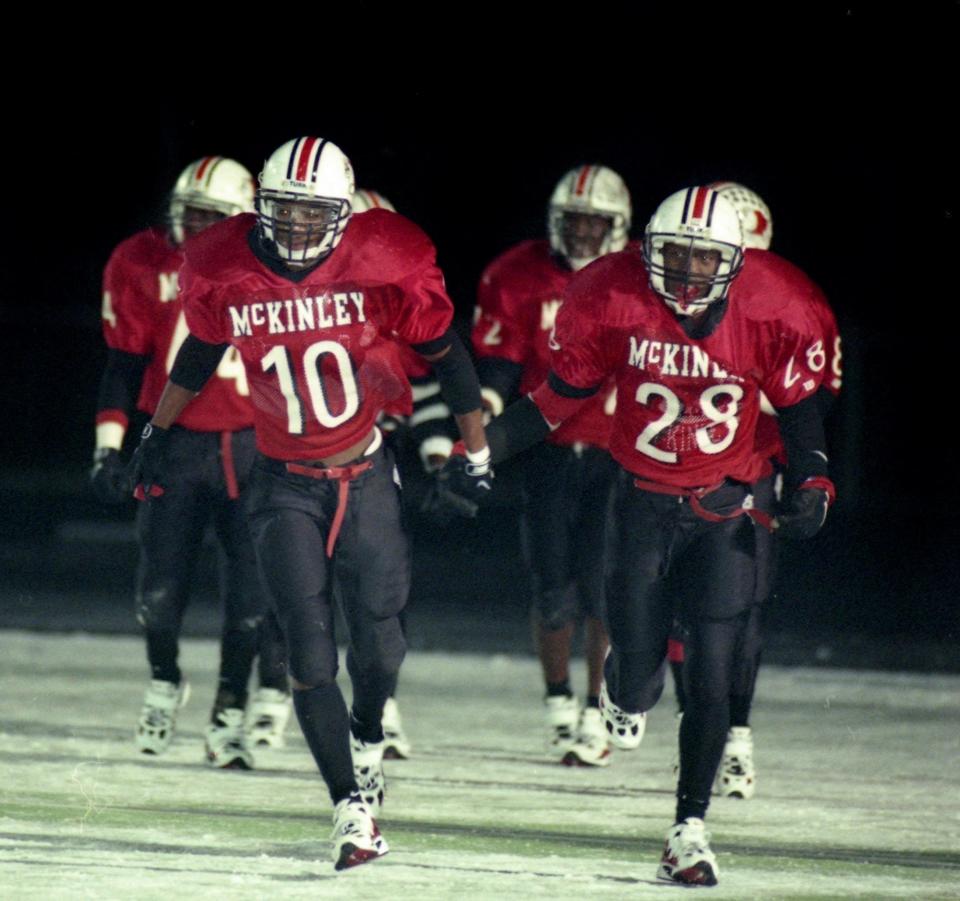 McKinley's James Gamble (10) and Stewart Lytle (28) take the field during the team's 1997 national championship season.