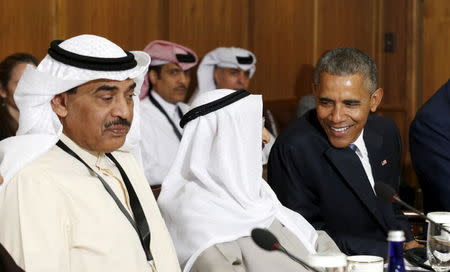 U.S. President Barack Obama talks with the Emir of Kuwait Sheikh Sabah Al-Ahmad Al-Jaber Al-Sabah as he hosts a working session of the six-nation Gulf Cooperation Council (GCC) at Camp David in Maryland May 14, 2015. REUTERS/Kevin Lamarque