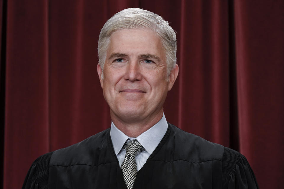 FILE - Supreme Court Justice Neil Gorsuch poses for a new group portrait, at the Supreme Court building in Washington, Friday, Oct. 7, 2022. Teaching is encouraged as a way to demystify the Supreme Court while exposing the justices to a cross-section of the public. Yet documents obtained by The Associated Press through public records requests reveal that some all-expense paid trips, particularly to attractive locales stateside and abroad, are light on classroom instruction, with ample time carved out for the justices' leisure. (AP Photo/J. Scott Applewhite, File)