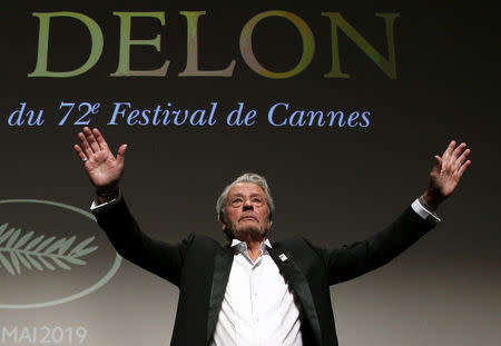 72nd Cannes Film Festival - Honorary Palme d’Or - Cannes, France, May 19, 2019. Actor Alain Delon gestures as he receives his honorary Palme d'Or Award. REUTERS/Stephane Mahe