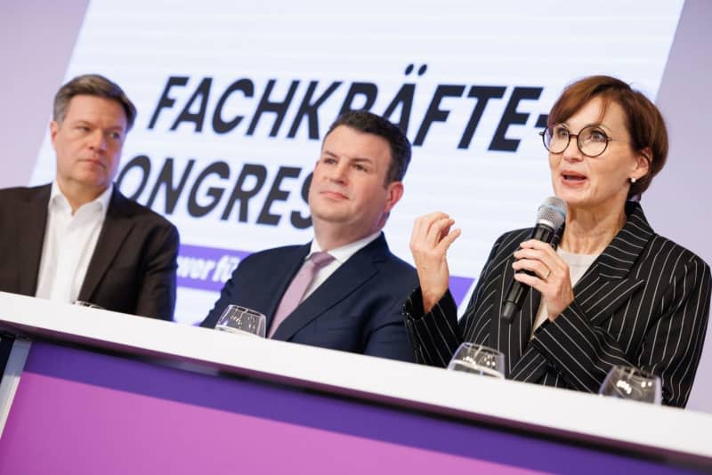(L-R) German Minister for Economic Affairs and Climate Protection Robert Habeck, German Minister for Labor and Social Affairs Hubertus Heil and German Minister for Education and Research Bettina Stark-Watzinger attend the opening of the Skilled Workers Congress 