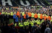 Britain Football Soccer - Hull City v Derby County - Sky Bet Football League Championship Play-Off Semi Final Second Leg - The Kingston Communications Stadium - 17/5/16 Hull's Steve Bruce (L) talks to the media as fans invade the pitch after reaching the Sky Bet Football League Championship Play-Off Final Action Images via Reuters / Craig Brough