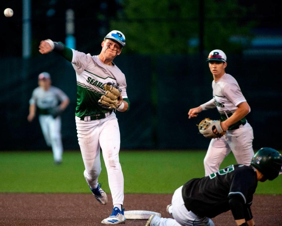 Peninsula shortstop Payton Knowles finishes off the top of the seventh with a 6-3 double play during the 3A District 3/4 championship game against Auburn on Saturday, May 14, 2022, at Auburn High School in Auburn, Wash.