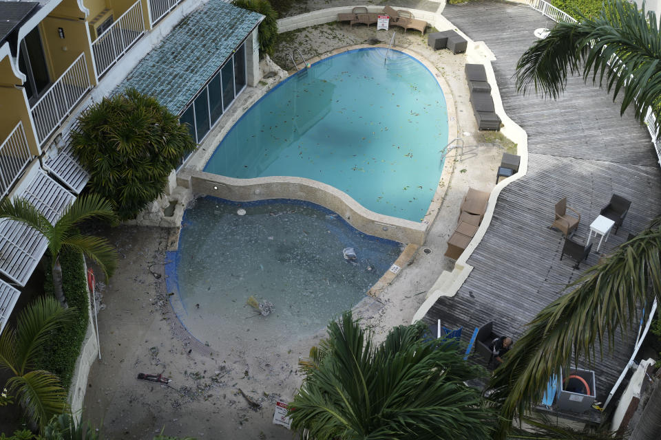 A hotel swimming pool remains closed the day after wind from Hurricane Beryl filled it with sand and debris in Bridgetown, Barbados, Tuesday, July 2, 2024. (AP Photo/Ricardo Mazalan)