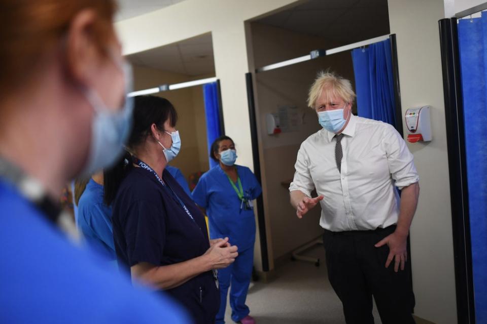Boris Johnson was photographed with and without a face mask on during his hospital visit on Monday (Peter Summers/PA) (PA Wire)