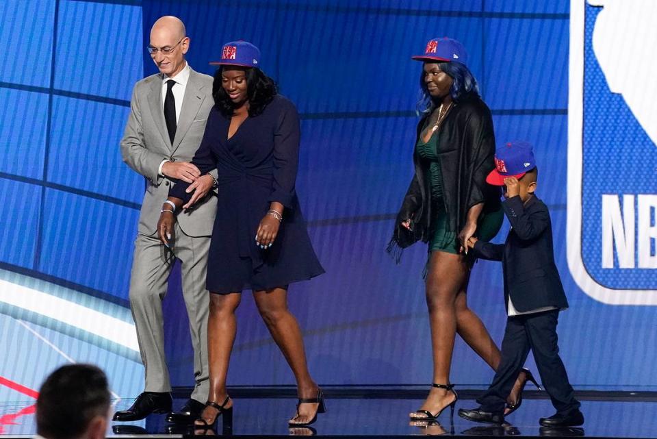 NBA Commissioner Adam Silver escorts relatives of former Kentucky guard Terrence Clarke after a tribute to Clarke during the NBA basketball draft, Thursday, July 29, 2021, in New York. Clarke was killed in a car accident in April 2021.