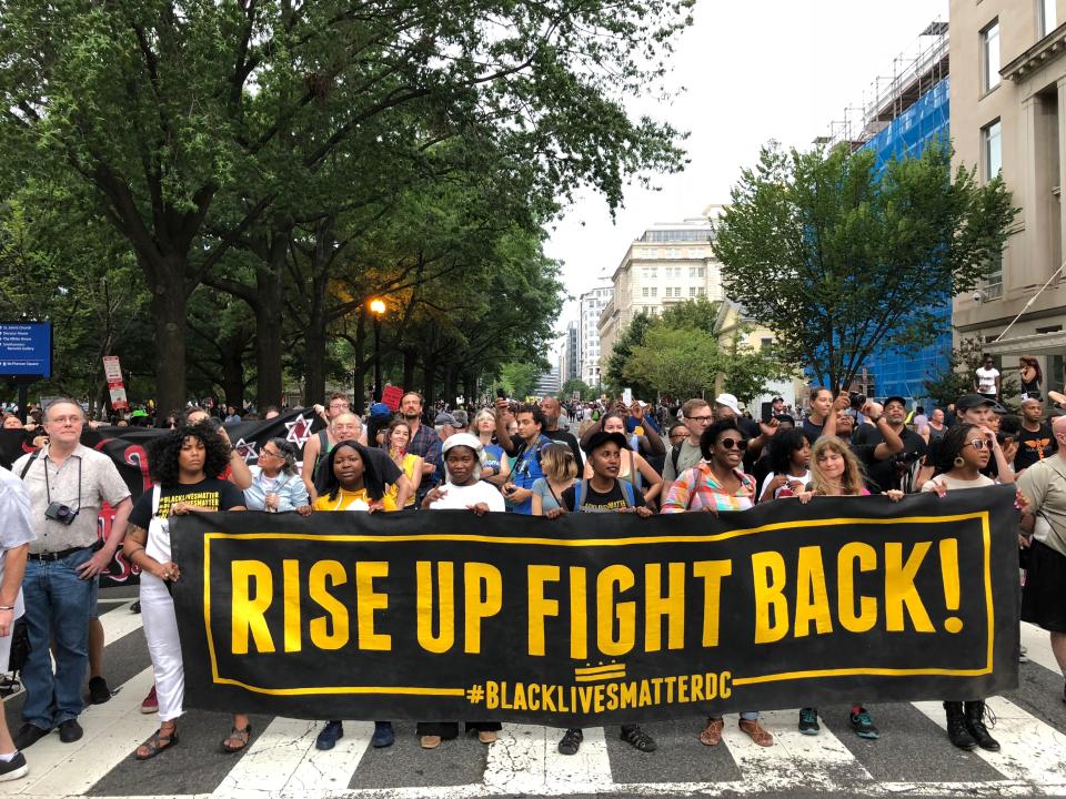 <p>Protestors march against the far-right’s Unite the Right rally August 12, 2018 in Washington, DC on the one-year anniversary of deadly violence at a similar protest in Charlottesville, Virginia. – Last year’s protests in Charlottesville, Virginia, that left one person dead and dozens injured, saw hundreds of neo-Nazi sympathizers, accompanied by rifle-carrying men, yelling white nationalist slogans and wielding flaming torches in scenes eerily reminiscent of racist rallies held in America’s South before the Civil Rights movement. (Photo: Daniel Slim/AFP/Getty Images) </p>