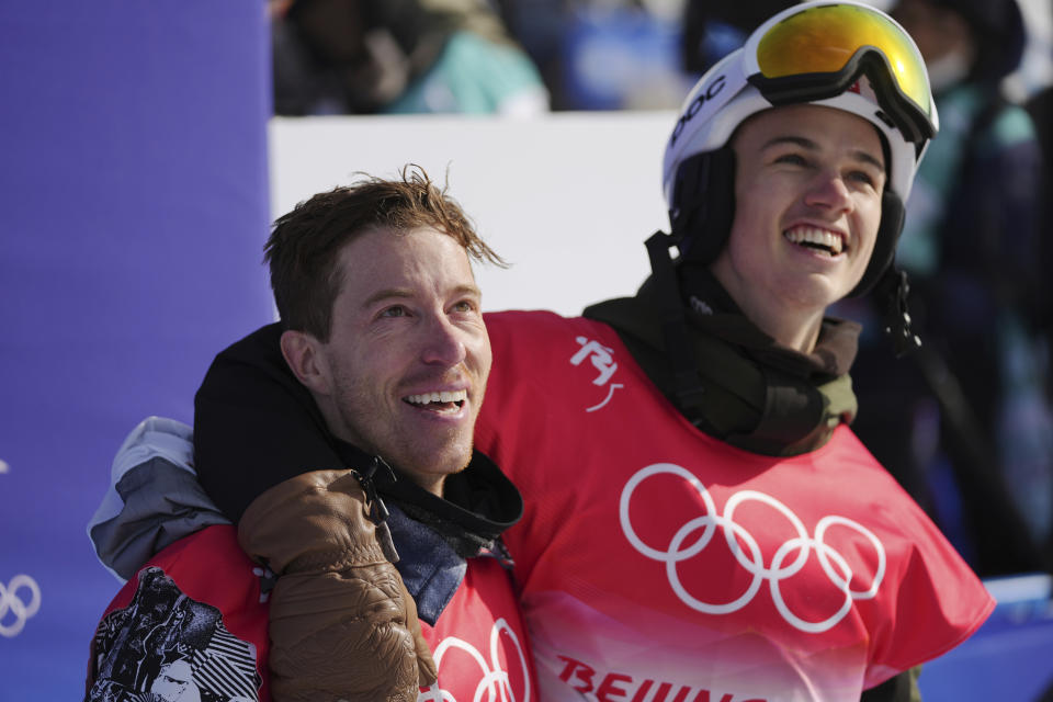 FILE - United States' Shaun White, left, and Switzerland's Jan Scherrer watches during the men's halfpipe finals at the 2022 Winter Olympics, Friday, Feb. 11, 2022, in Zhangjiakou, China. A key part in the first episode of the documentary series “Shaun White: The Last Run” zeroes in on the exact moment White decided to try to make a living out of snowboarding instead of trying to make friends. The four-part series documenting White's life and career starts Thursday, July 6, 2023, on MAX. (AP Photo/Matthias Schrader, File)