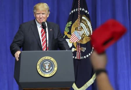 U.S. President Donald Trump is welcomed as he speaks to commanders and coalition representatives during a visit to U.S. Central Command and U.S. Special Operations Command at MacDill Air Force Base in Tampa, Florida, U.S., February 6, 2017. REUTERS/Carlos Barria