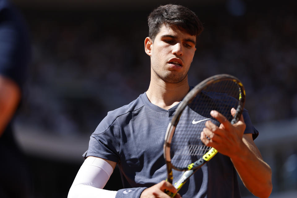 Spain's Carlos Alcaraz attends his semifinal match of the French Open tennis tournament against Italy's Jannik Sinner at the Roland Garros stadium in Paris, Friday, June 7, 2024. (AP Photo/Jean-Francois Badias)