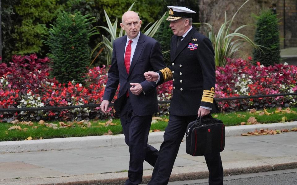 Defence Secretary John Healey (left) and Chief of the Defence Staff Admiral Sir Tony Radakin arrive at Downing Street this morning