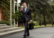 Spanish Prime Minister Mariano Rajoy waves as he arrives for first cabinet meeting after winning a parliamentary confidence vote for a second term ending 10 months of political paralysis that included two inconclusive elections, at the Moncloa Palace in Madrid, November 4, 2016. REUTERS/Sergio Perez